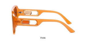 Detail of orange translucent frame sunglasses with gold metal temple decorations