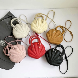 Shell-shaped crossbody bag set in six colors with floral relief texture and metal handles