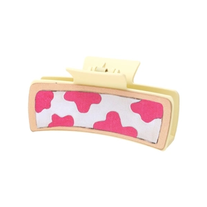 Rectangle cream hair claw clip with pink cow print pattern in a matte finish