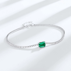 Elegant S925 sterling silver tennis bracelet with emerald cut green gemstone center