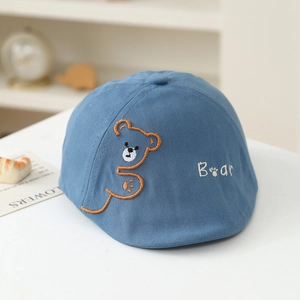 Detailed embroidery of a cute orange bear and 'Bear' text on light blue cotton kids' cap