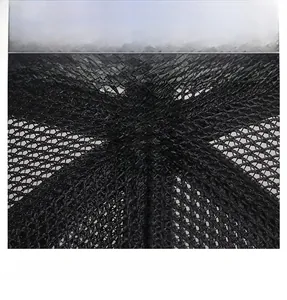 Detailed close-up of the breathable black mesh crown on a summer baseball cap