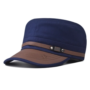 Close-up of navy cotton military cap with brown leather brim and FS FASHION metal logo