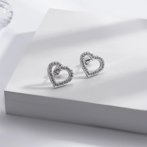 Hollow heart stud earrings in silver stainless steel with sparkling clear zircon accents