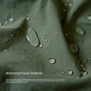 Waterproof army green fabric for kids painting aprons showing water droplets on texture
