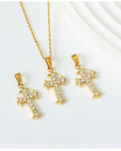 Macro shot of gold-plated cross pendants with cubic zirconia, excludes chain