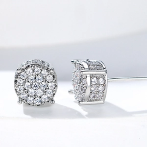 Macro shot of round micro-pave cubic zirconia stud earrings with silver-tone plating