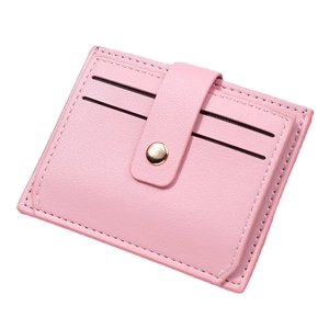 Slim pink leather card holder for women with multi-slots and a gold snap button closure