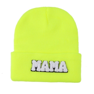 Neon yellow knit beanie featuring MAMA towel embroidery patch in a minimalist street style