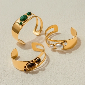 Gold stainless steel open cuff bracelets set with pearl, malachite and tiger eye stones
