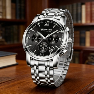 Detailed macro view of an elegant men's watch featuring a black dial and silver steel band.