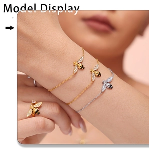 Detail of bee bracelet and ring set with micro-pave zircons in gold and silver finish
