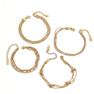 Set of four gold-plated stainless steel bracelets with sparkling zircons and bead chains