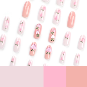 Pink peach press-on nails with 3D heart rhinestones and elegant long oval shape
