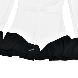 Detail view of white bodysuit featuring black ruffle trim and smooth elastic fabric