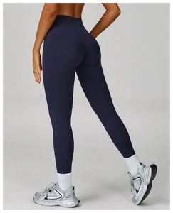 Detail of high-waist yoga leggings showing curved back seams for butt-lifting effect