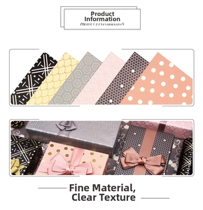 Detail of geometric gift wrapping paper with metallic gold foil textures and ribbons