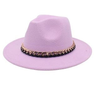 Detail of lavender fedora hat showing textured felt fabric and gold metal chain band