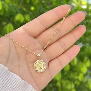 Detailed view of an 18K gold-plated Virgin Mary octagonal pendant with white zircon stones