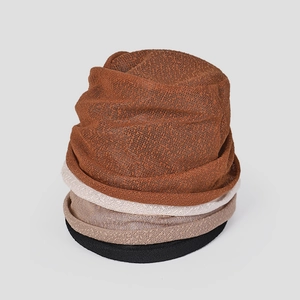 Detail showing stacked lightweight lace mesh bucket hats in various colors