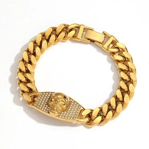 Gold-plated Cuban link chain bracelet with a skull shield design and pave-set zircons