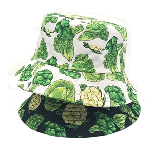 Unisex bucket hat with green vegetable prints in black and white canvas styles