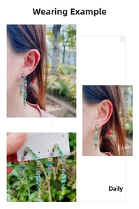 Détail de boucles d'oreilles pendantes en argent avec cristaux de zircon colorés