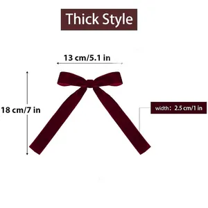 Detailed view of dark red velvet Christmas tree bow with dimensions 13cm by 18cm