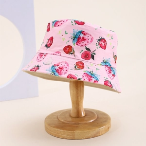 Detail of pink strawberry print kids bucket hat featuring reinforced stitching on the brim