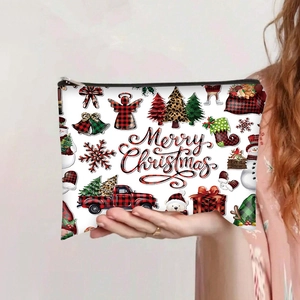Detail of Christmas themed canvas pouch with festive prints and durable black zipper