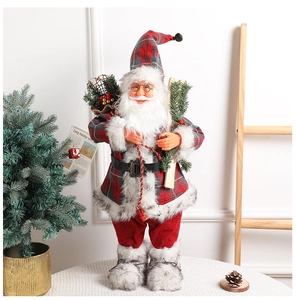 Detailed view of standing Santa doll with plaid fabric, skis, and gift bag on white table