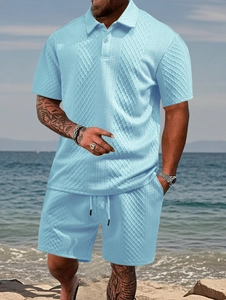 Detail of light blue waffle knit polo set showing textured jacquard fabric and polo collar