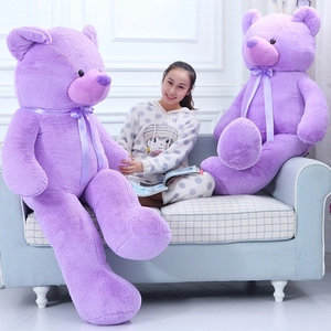 Close-up of huge purple teddy bears with silk bows showing high-density plush texture