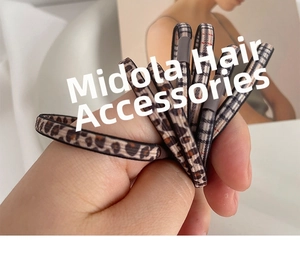 Detail view of high-elastic leopard print and plaid pattern seamless hair scrunchies