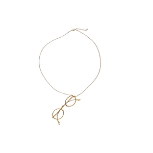 Minimalist gold metal necklace featuring a retro round eye pendant on a long chain