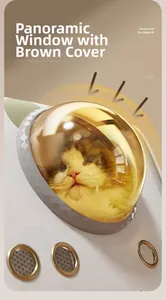 Detail of pet carrier with panoramic brown window and breathable gold metal air holes
