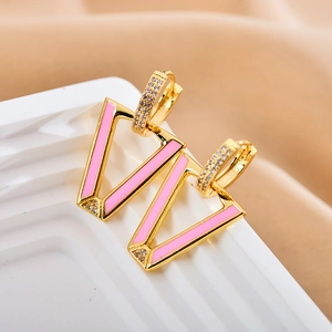 Modern V-shaped gold earrings with pink enamel and sparkling crystals in a pair