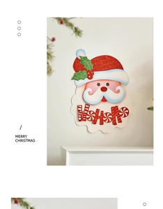 Detailed view of red glitter Santa wall decor with HoHoHo text for Christmas styling