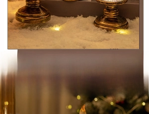 Detail of vintage copper candle lantern with warm LED flame in a snowy festive setting