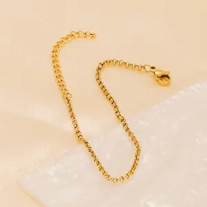 18K gold plated stainless steel pearl chain necklace with lobster clasp on silk background