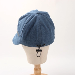 Deep blue denim fisherman hat with wide brim and adjustable drawstring for women