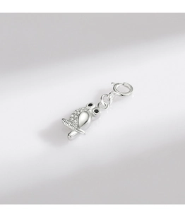 Macro detail of 925 sterling silver owl pendant with micro-set black and clear stones