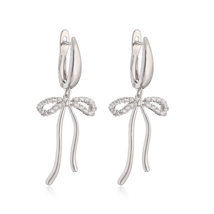 Elegant silver bow earrings featuring shimmering zircon stones and dangling ribbon design