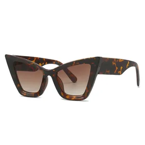 Stylish cat-eye sunglasses with tortoiseshell frames and brown gradient lenses for women