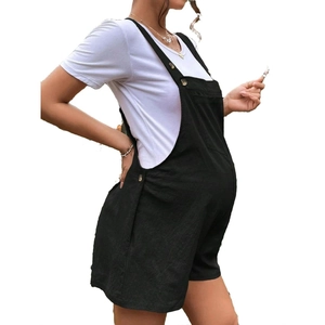 Side view of black maternity overalls shorts with adjustable buttons and a white t-shirt