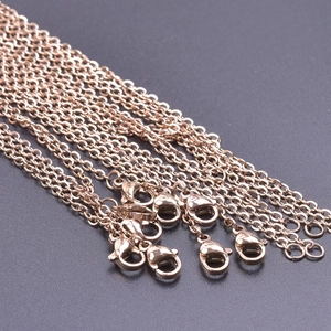 Close-up of 2mm rose gold cross chains with lobster clasps for DIY jewelry making