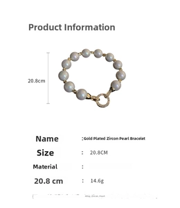 Detailed view of grey pearl bracelet with gold-plated zircon buckle on white background