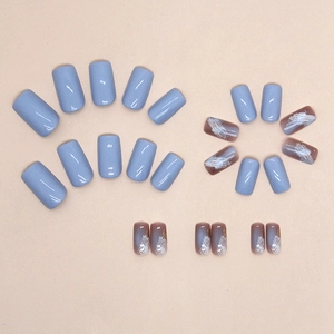 Short square press-on nails set featuring light blue and gold foil marble artistic designs