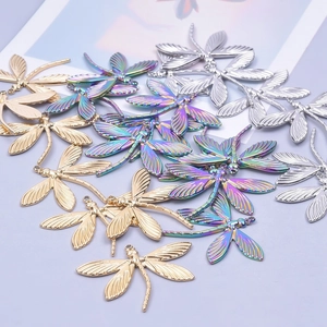 Detailed dragonfly pendants in gold, silver, and rainbow finishes for DIY jewelry making