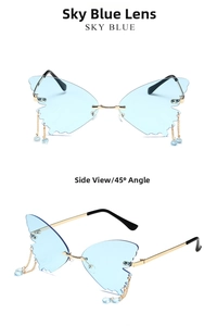 Detail view of sky blue butterfly rimless sunglasses with metal charms and gold temples